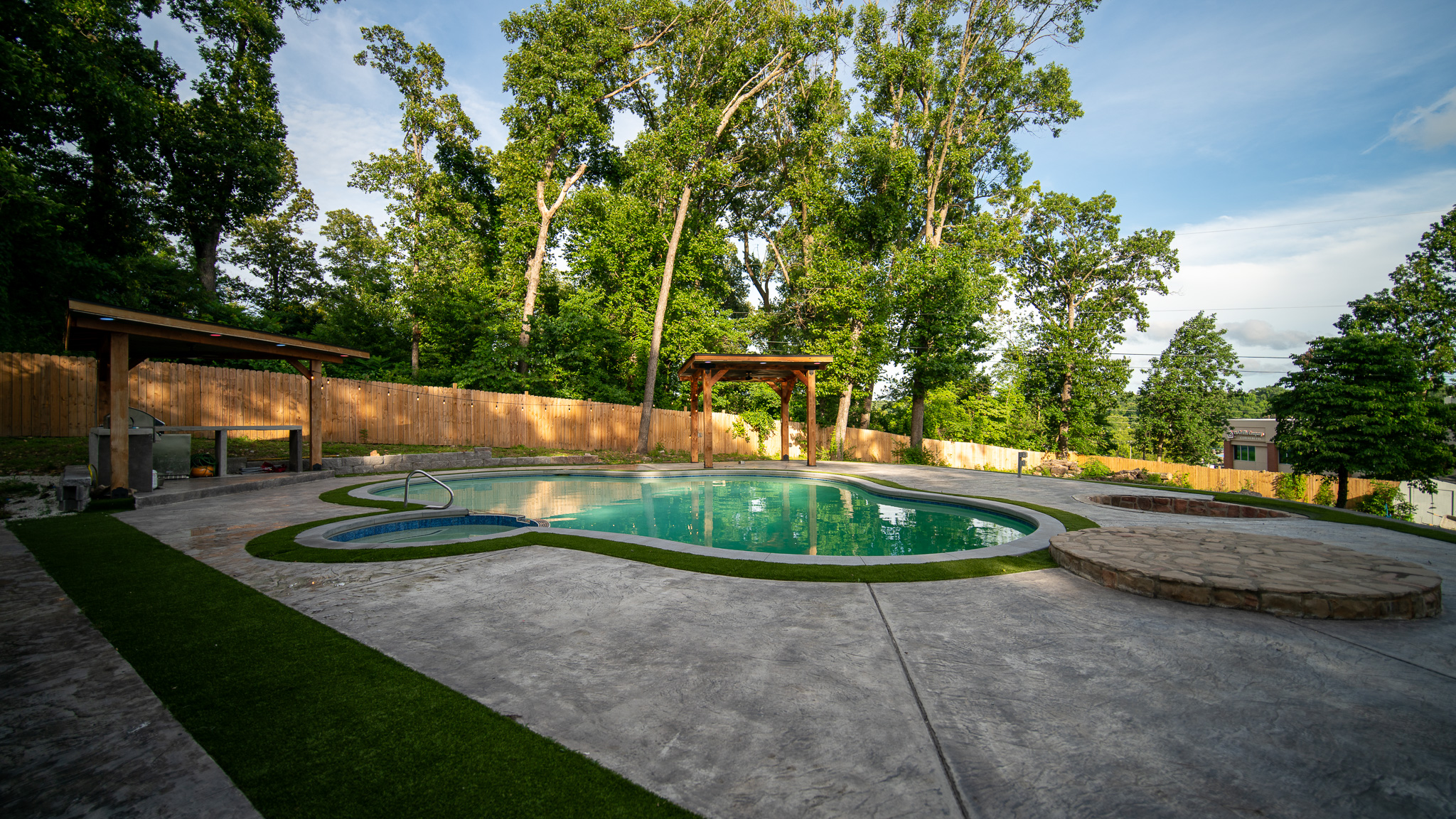 Pool and stamped-concrete patio, wide view